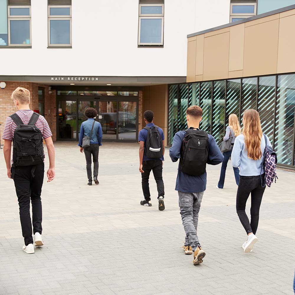 Students Walking Towards A School